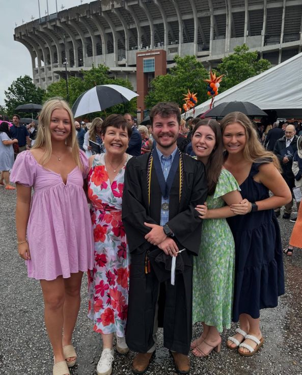 Jennifer with all four kids at graduation ceremony