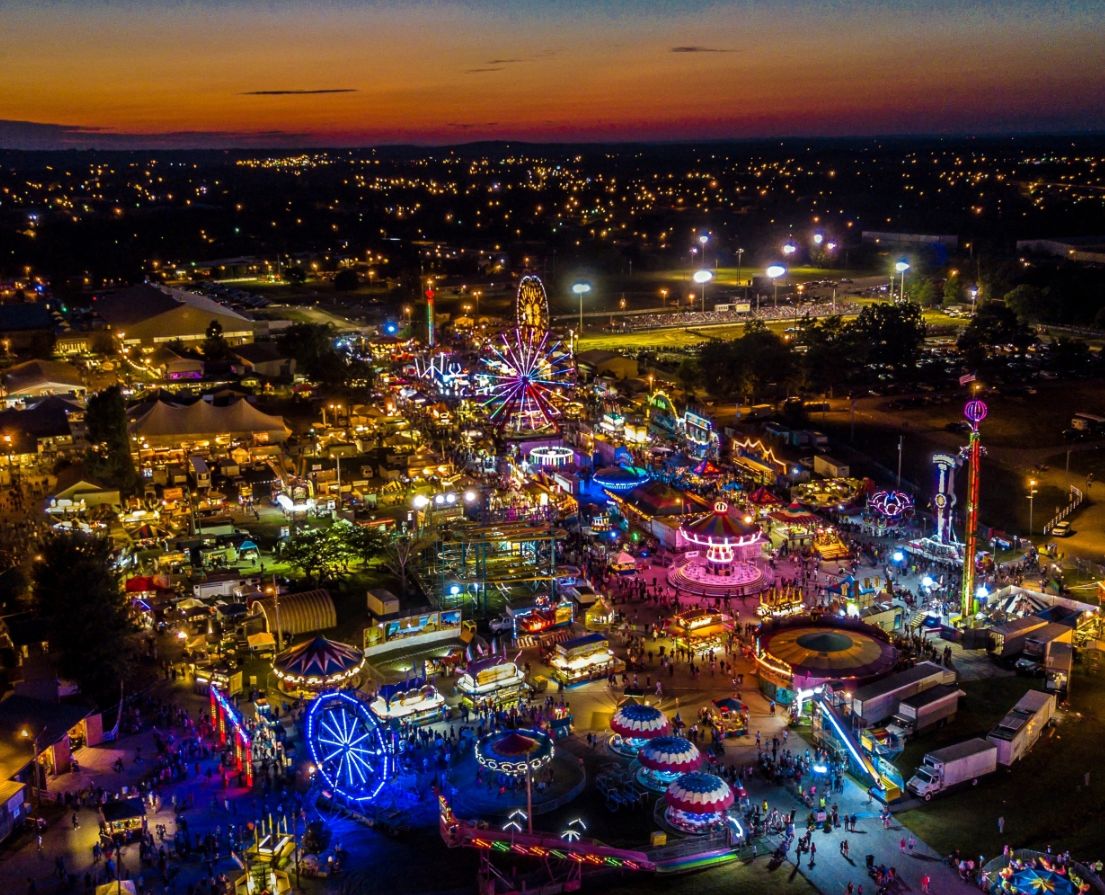 Aerial night view of the Tennessee State Fair with glowing carnival lights